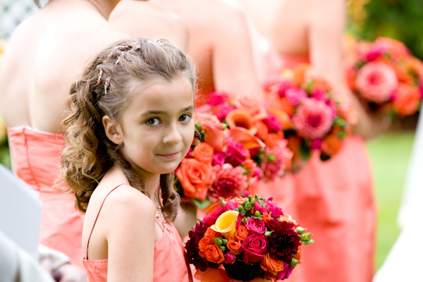 adorable flower girl in coral colored dress - photo by Seattle based wedding photographers La Vie Photography